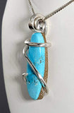 Turquoise Kingman Stone Pendant Hand Wrapped in Silver